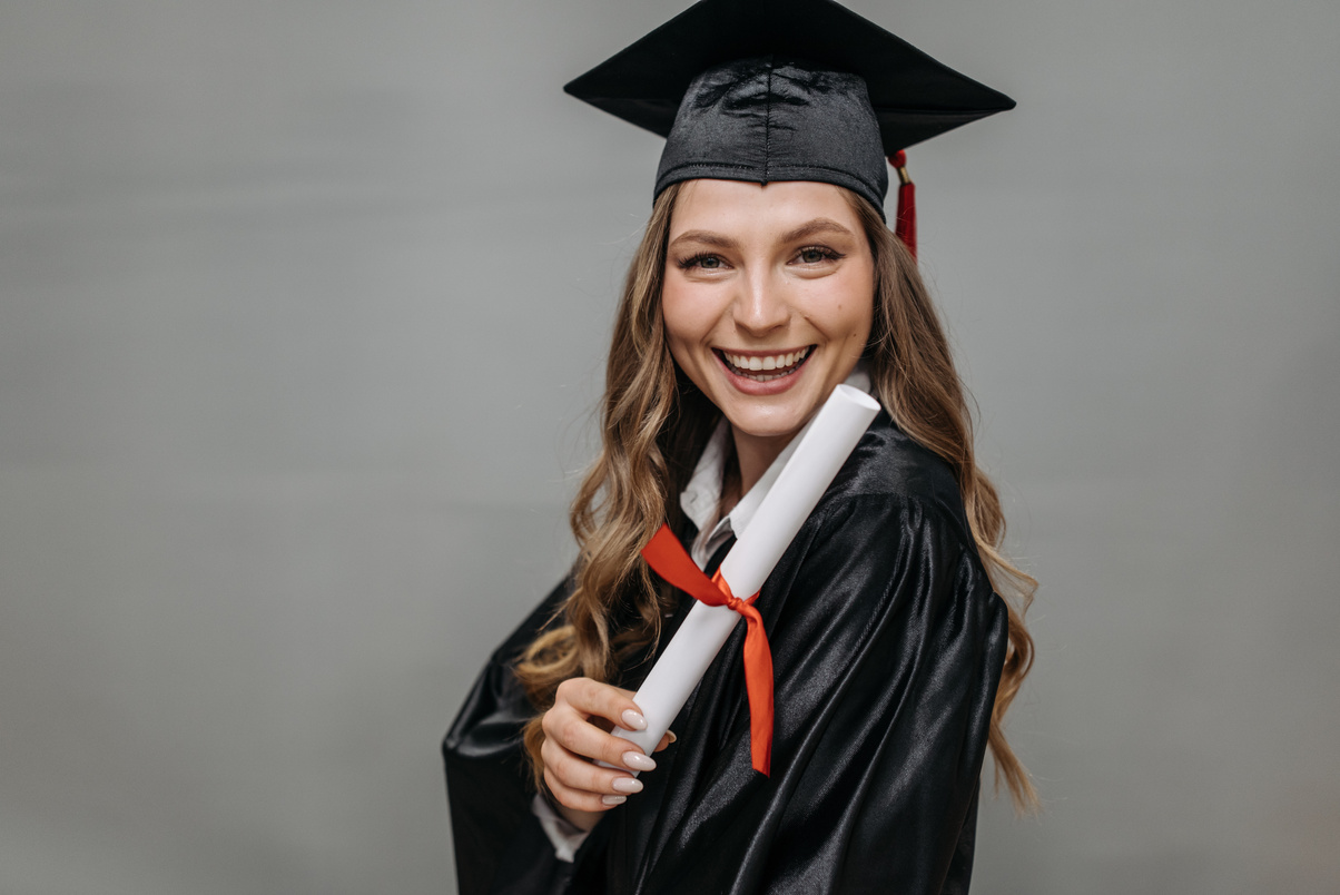 Photo of Happy Woman Holding Diploma