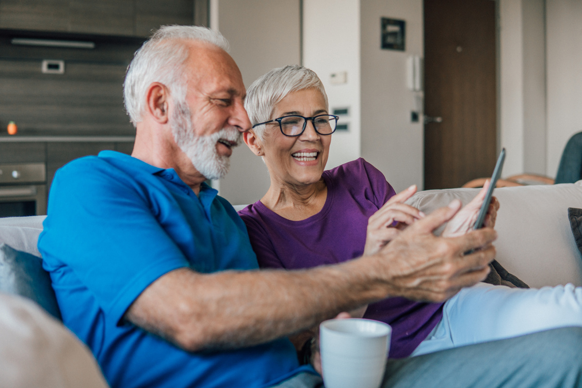 Old couple with digital tablet